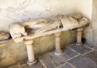 Stone effigy of knight in porch of Church of Saint Michael and All Angels, Figheldean, Wiltshire,