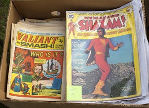 Close up of old comic magazines in box at car boot sale, Suffolk, England, UK