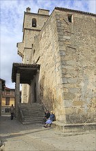 Old man and woman sitting by church in Garganta la Olla, La Vera, Extremadura, Spain, Europe