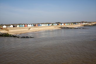 Colourful beach huts line the promenade at Southwold, Suffolk, England, United Kingdom, Europe