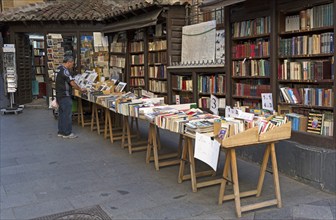 Books on display stalls outside book shop in Calle Mayor, Madrid city centre, Spain, Europe