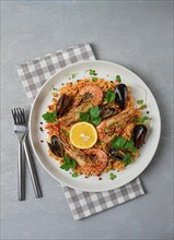 Seafood paella, shrimp and mussels risotto, rice, homemade, top view, no people