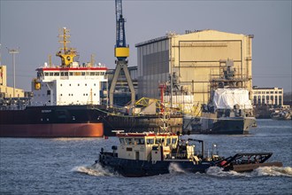 Port of Hamburg, Blohm + Voss shipyard, dredger OSTERIFF and corvette of the German Navy,