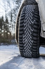 Winter tyres, driving on a road with snow cover, grip on the snow thanks to the special tread and