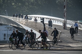 Cyclists on the Lille Langebro cycle and pedestrian bridge over the harbour, Copenhagen is