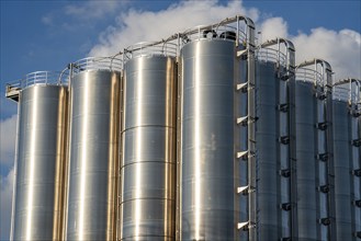 Stainless steel tanks of a large silo facility in Duisburg inland harbour, Duisburg-Neuenkamp, for