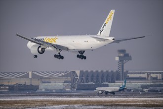 AeroLogic cargo aircraft, Boeing 777F approaching Frankfurt FRA airport, air traffic control tower,