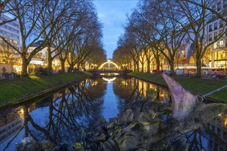 Christmas market, on Königsallee, Kö, Stadtgraben pond, Tritonenbrunnen fountain, Christmas lights,