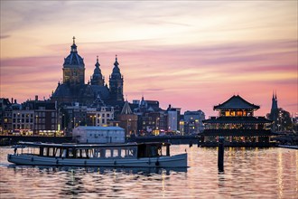 Amsterdam, Netherlands, city centre, St. Nicholas Basilica, restaurant boat, canal cruise