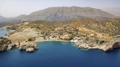 Aerial view of small bay with small idyllic sandy beach Agios Pavlos Beach on south coast of Crete