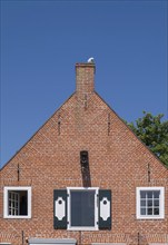 House gable, gable of a historic brick house at the harbour, Greetsiel, Krummhörn, East Frisia,