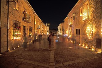 Calle Mayor at night, lit up with candles, Conciertos de las Velas festival of lights, Pedraza,