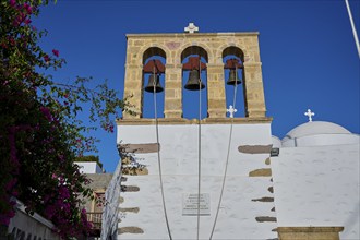 Agios Ioannis Prodromos Church, Historic church with three bell arches, surrounded by white walls