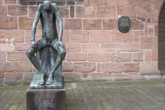 Bronze sculpture of Job, created by the German sculptor Gerhard Marcks in 1957, in front of St