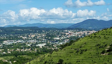 Aubenas. View of the city and the Monts du Vivarais. Ardeche. Auvergne-Rhone-Alpes. France