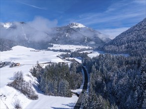 Winter landscape with deep blue sky and view of a snow-covered village, Salzburger Land, Austria,