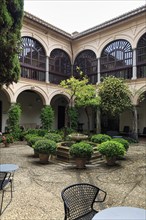 Inner courtyard with fountain and flower pots, Hotel Parador de Granada, former Nasrid palace,