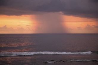 Rainstorm and clouds at sea at sunset viewed from Galle, Sri Lanka, Asia