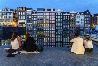 Canal houses on the Damrak, in the centre of the old town of Amsterdam, harbour, starting point of