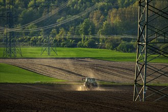 Tractor working a field near Grevenbroich, in spring, Germany, Europe