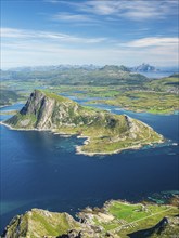 View from top of mountain Stornappstind to island Offersøya, large cliff in the sea, mountain