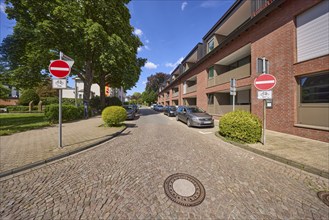 Traffic sign prohibiting entry to the one-way street Nonnenwall with residential buildings in