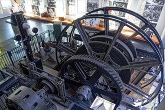 Winding engine with depth indicator to raise and lower lift cage in mine shaft at Le Bois du Cazier