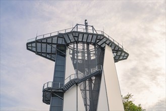 A modern metal observation tower with stairs that stands out against the sky, Rappbodetalsperre,