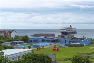 Seawater swimming pool on the offshore island of Heligoland, beach chairs, passenger ship Maud,