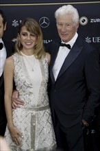 Richard Gere with woman Alejandra Gere at the premiere of Wisdom of Happiness, A heart-to-heart