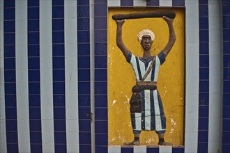 Mural decoration representing a disciple of the Mouride brotherhood Senegal . Mouridism is a muslim