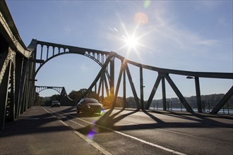 Cars drive over the Glienicke Bridge in Potsdam. The Glienicke Bridge today forms the city boundary