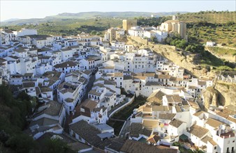 Whitewashed buildings on hillside in village of Setenil de las Bodegas, Cadiz province, Spain,