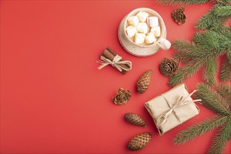 Christmas or New Year composition. Decorations, box, cinnamon, cones, fir and spruce branches, cup