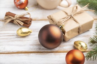 Christmas or New Year composition. Decorations, box, golden balls, cinnamon, fir and spruce