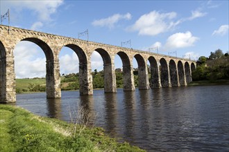 Stone arches of railway viaduct crossing River Tweed, Berwick-upon-Tweed, Northumberland, England,