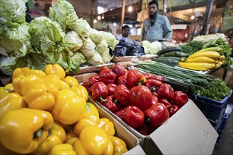 Vendor selling vegetables at a market, ahead of the presentation of the Interim Budget 2024 by