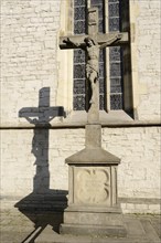 Jesus Christ on the cross in front of the parish church of St Christophorus, Werne, North