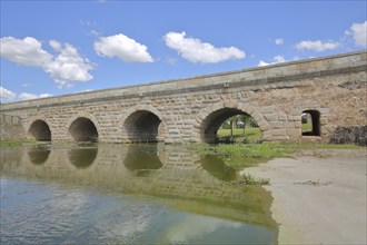 Roman stone arch bridge Puente Romano de la Puerta over the Rio Albarregas, UNESCO, Forum Roman,