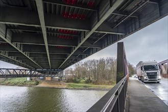 A42 motorway bridge, (red arches) over the Rhine-Herne Canal, with massive structural damage,