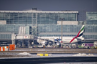 Emirates at the terminal at Frankfurt FRA Airport, Fraport, in winter, Hesse, Germany, Europe