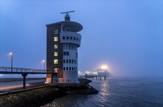 Thick fog in winter, hanging over the mouth of the Elbe into the North Sea, radar tower of the