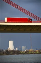 Beeckerwerther Brücke, motorway bridge, A42, truck, cargo ship on the Rhine, behind the STEAG