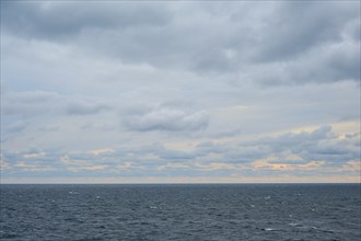 Wide sea under a cloudy sky, waves and a quiet horizon, North Sea, Denmark, Europe