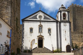 Small chapel with stone steps and historical details, church Igreja de São Tiago, library, Muralha