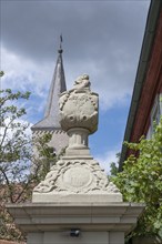 Vase attachment on a courtyard gate, 1774, behind the tower of the parish church of St John the