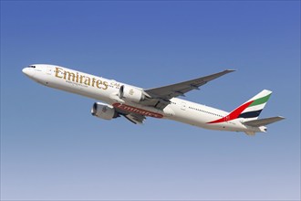 An Emirates Boeing 777-300ER aircraft with registration number A6-EGQ at the airport in Dubai,