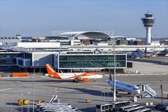 An EasyJet Airbus A320 aircraft, registration G-EZPD, with Terminal 1 extension at Munich Airport,