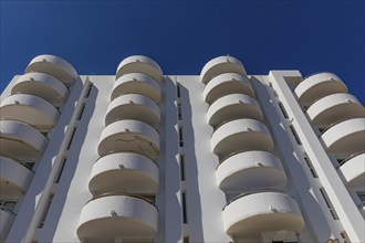 Modern holiday flats with round balconies at the harbour of Santa Eularia, Ibiza, Balearic Islands,