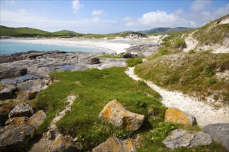 Rocky headland and sandy beach at Bagh a Deas, South Bay, Vatersay island, Barra, Outer Hebrides,